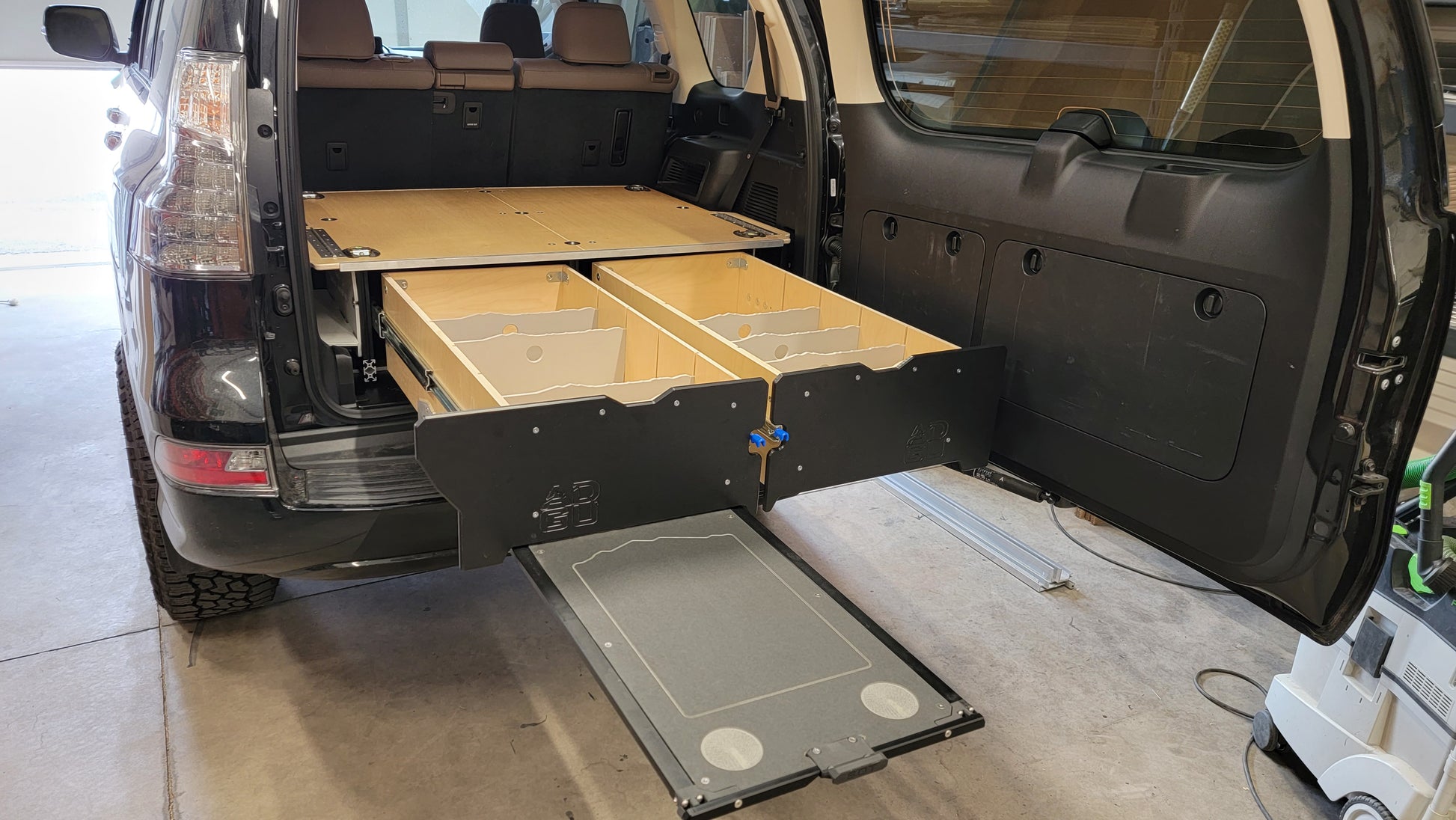 GX460 drawer system with sleeping platform for vehicle organization
