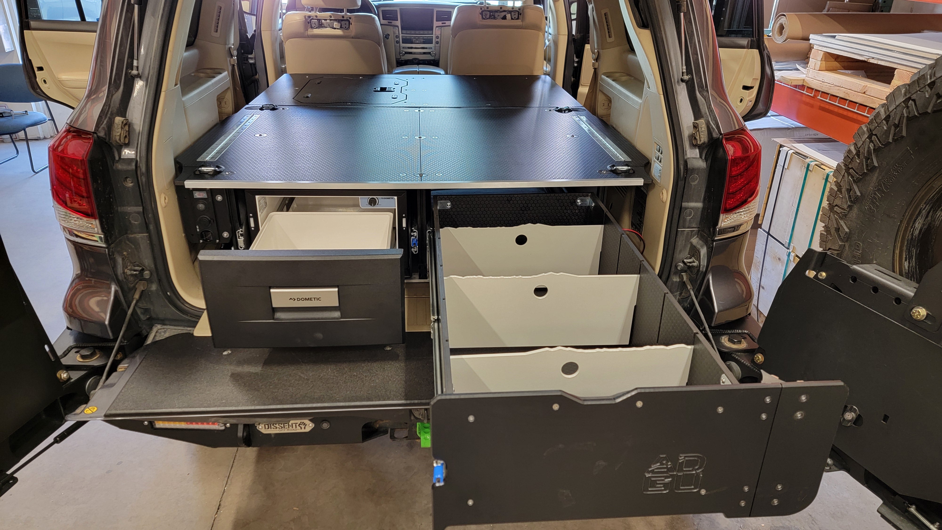 200 Series Toyota Land Cruiser LX570 drawer system with fridge and sleeping platform for vehicle organization perfect for overland travel.